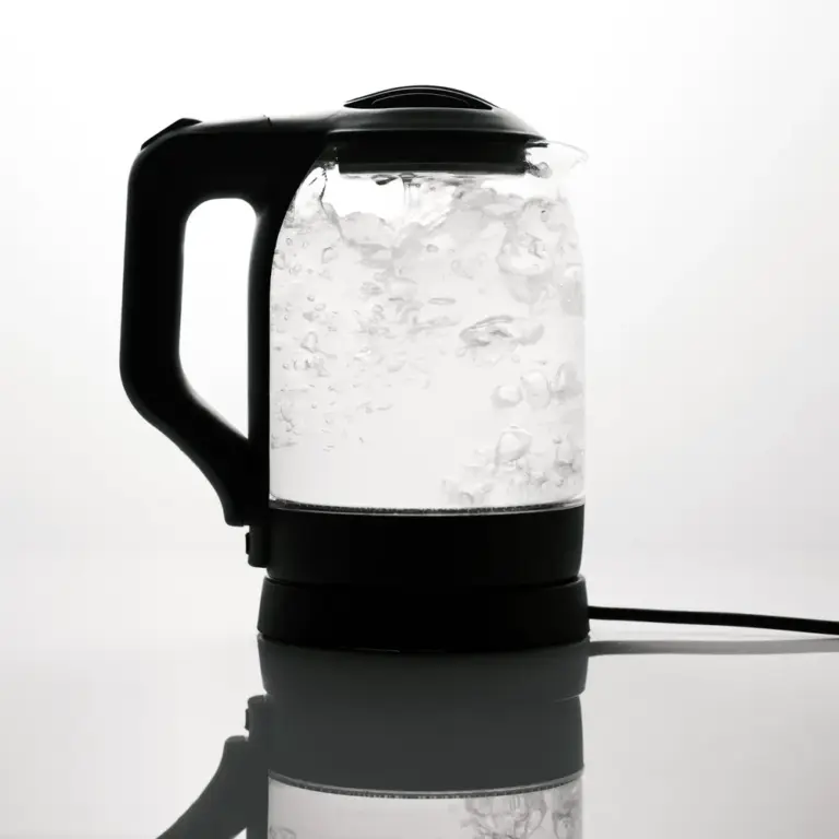 Sleek electric glass kettle boiling water on reflective surface