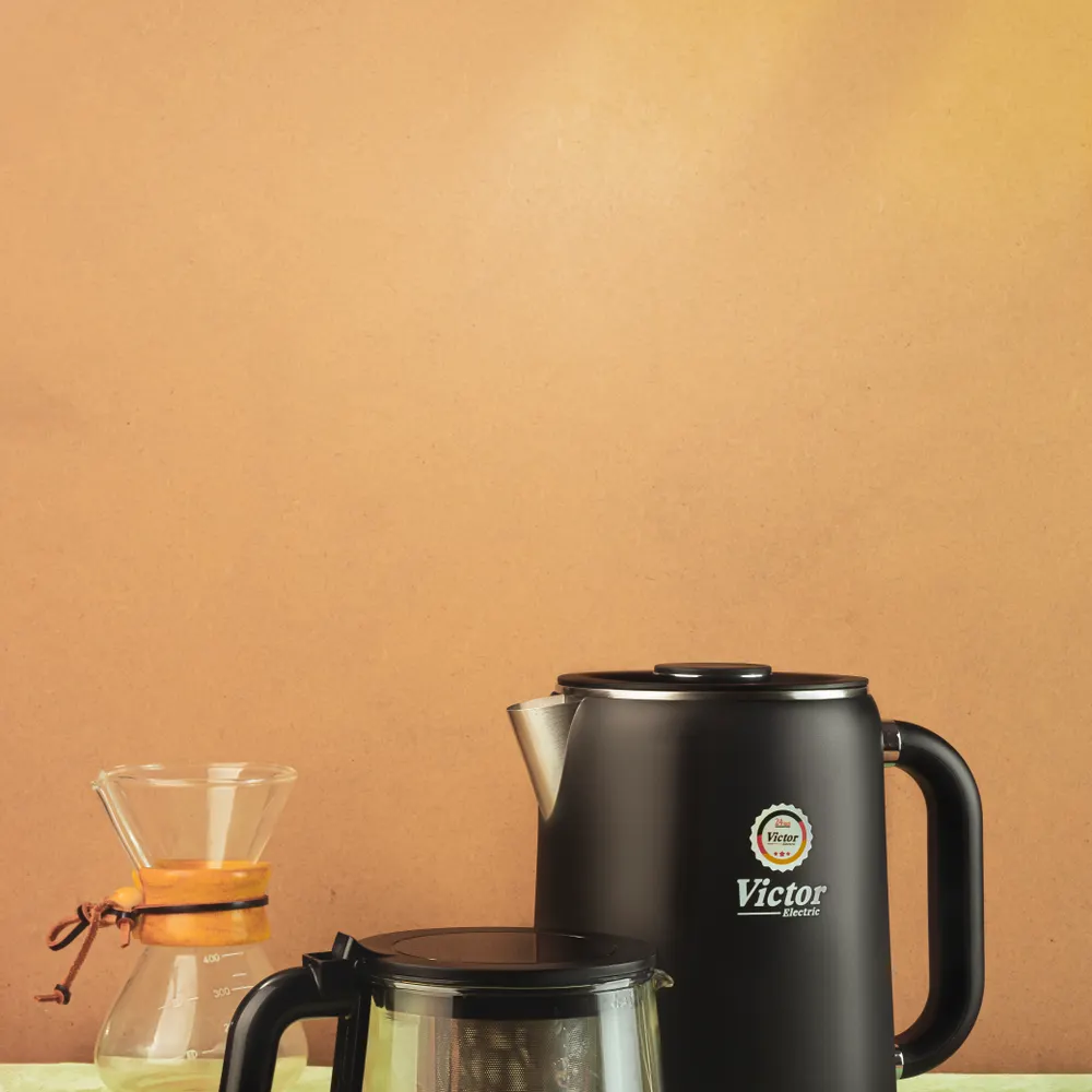 Modern electric kettle with coffee maker setup on kitchen counter