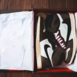 Trendy sporty boots placed in gift box - unisex sneaker packaging